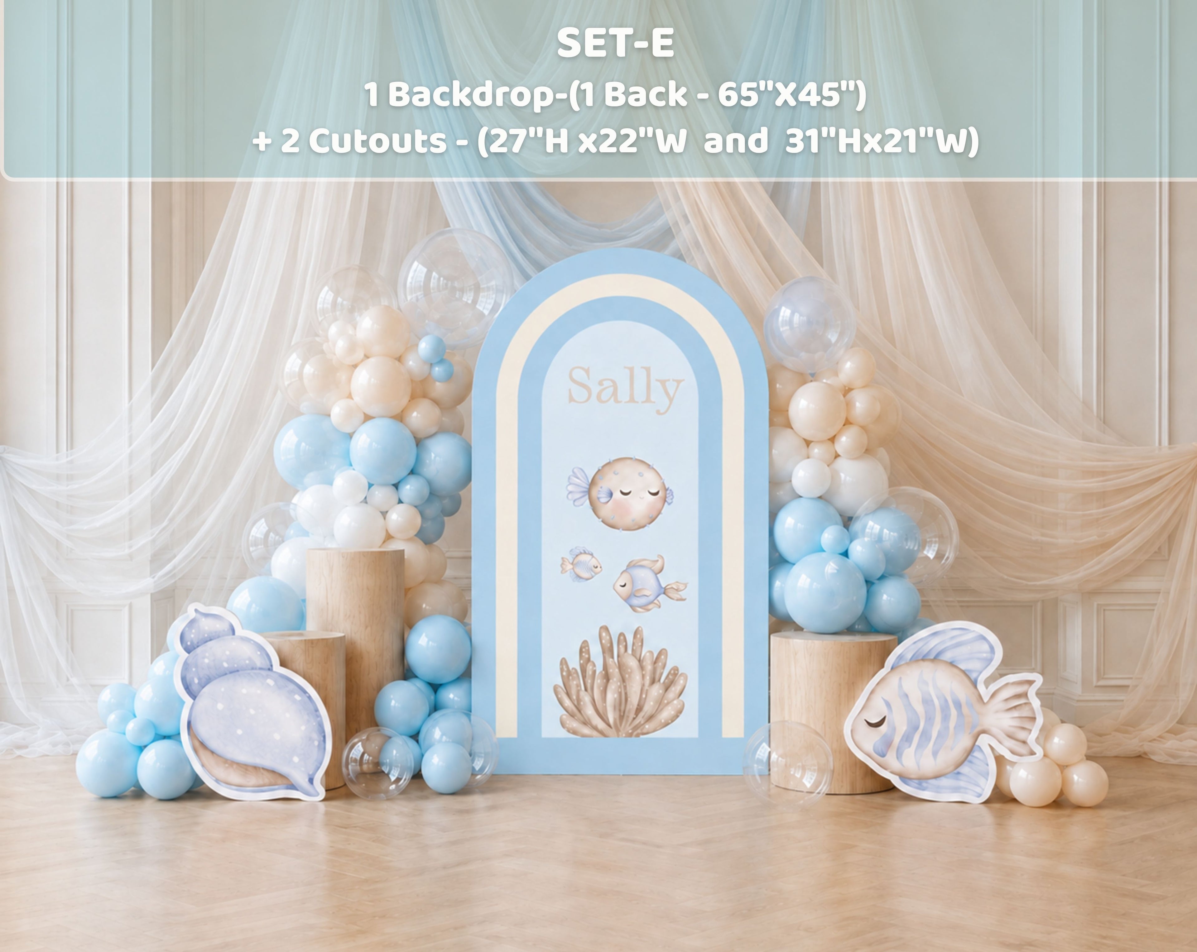 Personalized blue ocean birthday backdrop with curtain details, balloon clusters and under the sea decorations for a kids celebration.