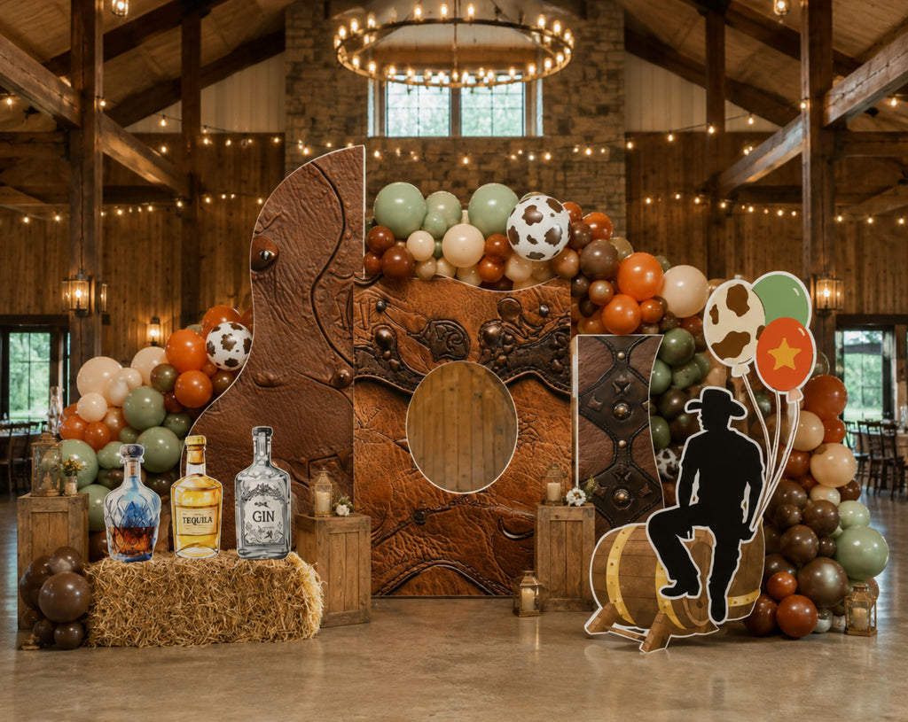 Rustic cowboy party display with personalized western backdrop, country inspired accents and matching birthday cutouts.