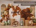 Personalized western birthday backdrop with rustic wood styling, cowboy themed cutouts and Wild West party decorations for a custom celebration.