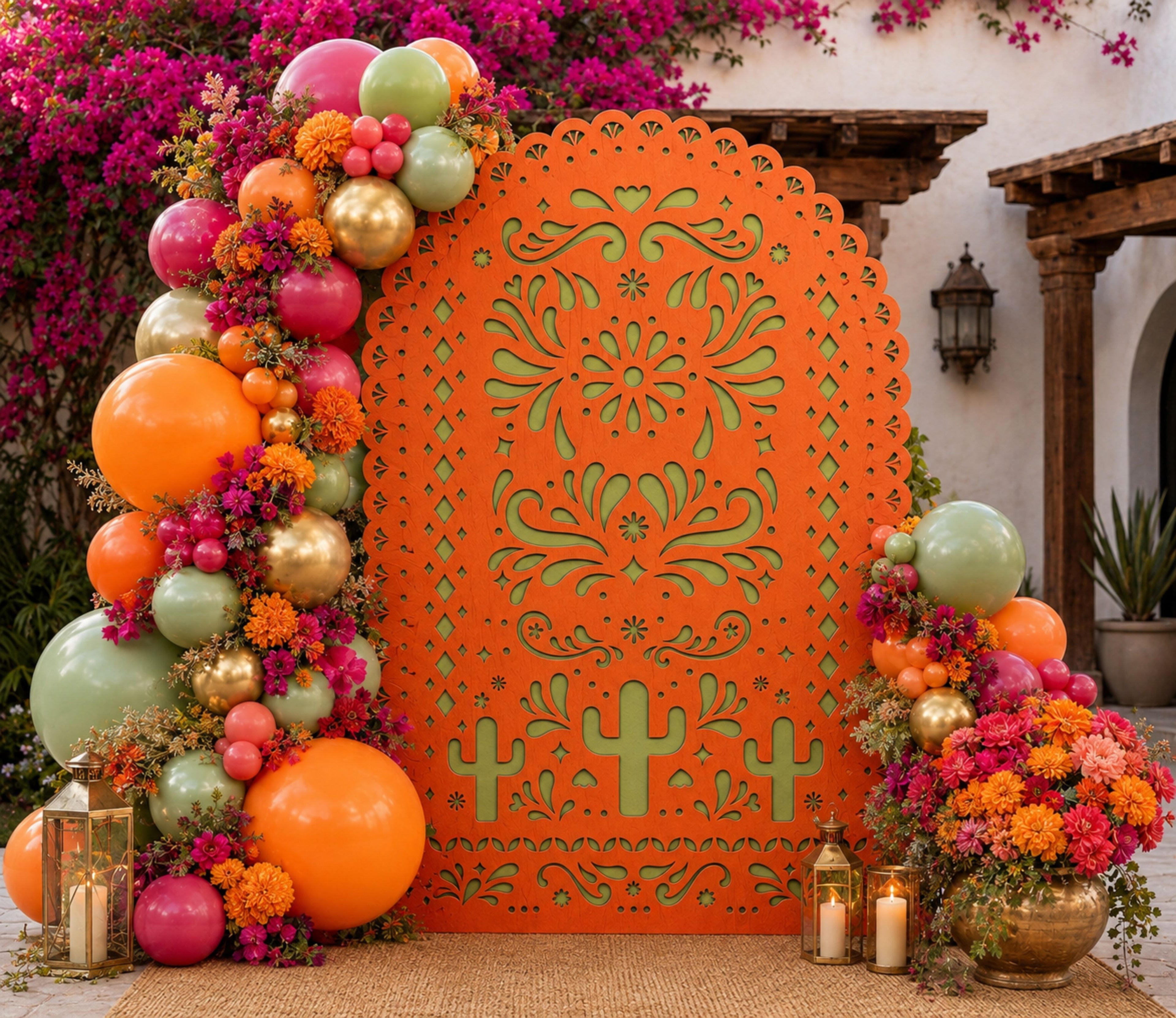 Terracotta papel picado backdrop with colorful balloons and flowers for traditional Mexican event