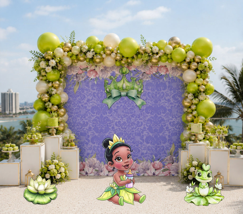 Purple frog princess birthday backdrop with green floral decor for a fairytale celebration