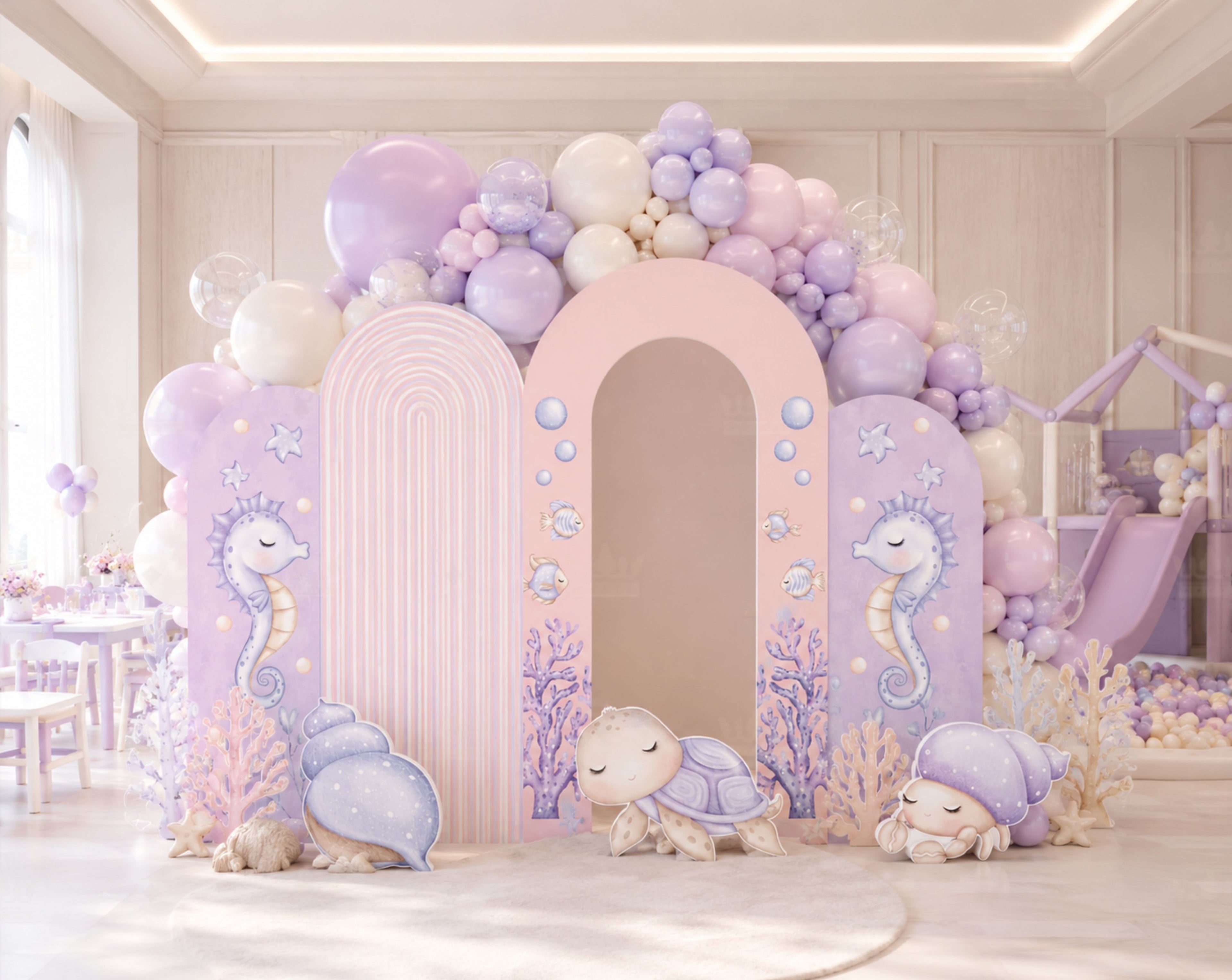 Pastel under the sea party backdrop with lavender arch panels, ocean theme styling and elegant balloon decorations.