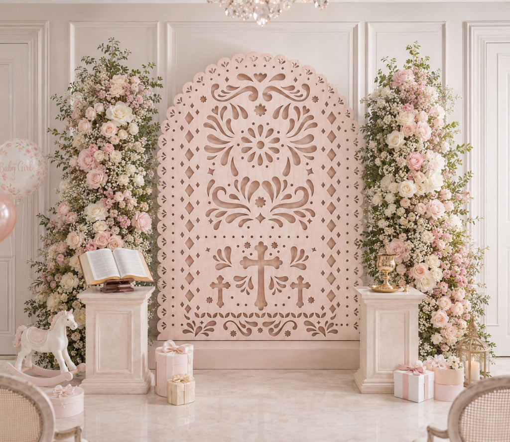 Blush pink religious papel picado backdrop with cross design and floral Christian event decor