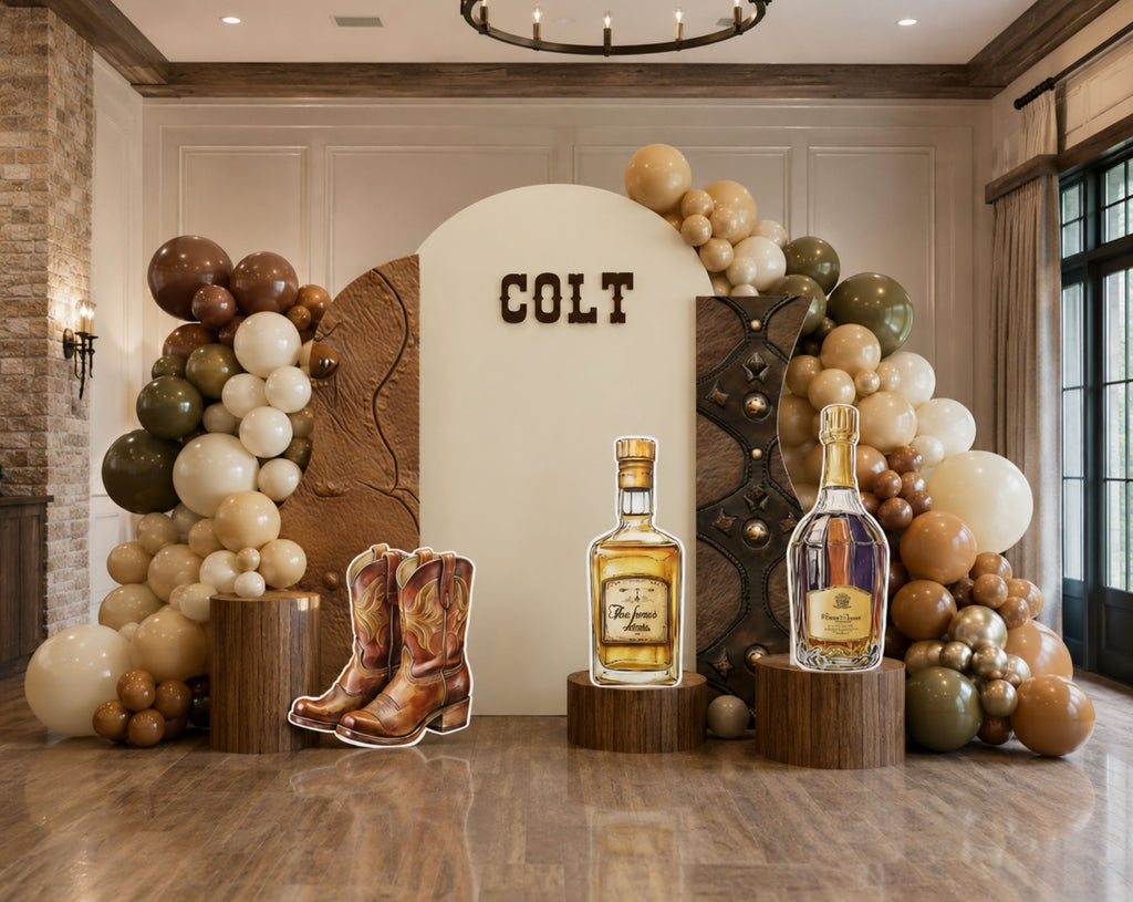 Cowboy themed birthday backdrop and cutouts with rustic western styling for a personalized Wild West party celebration.