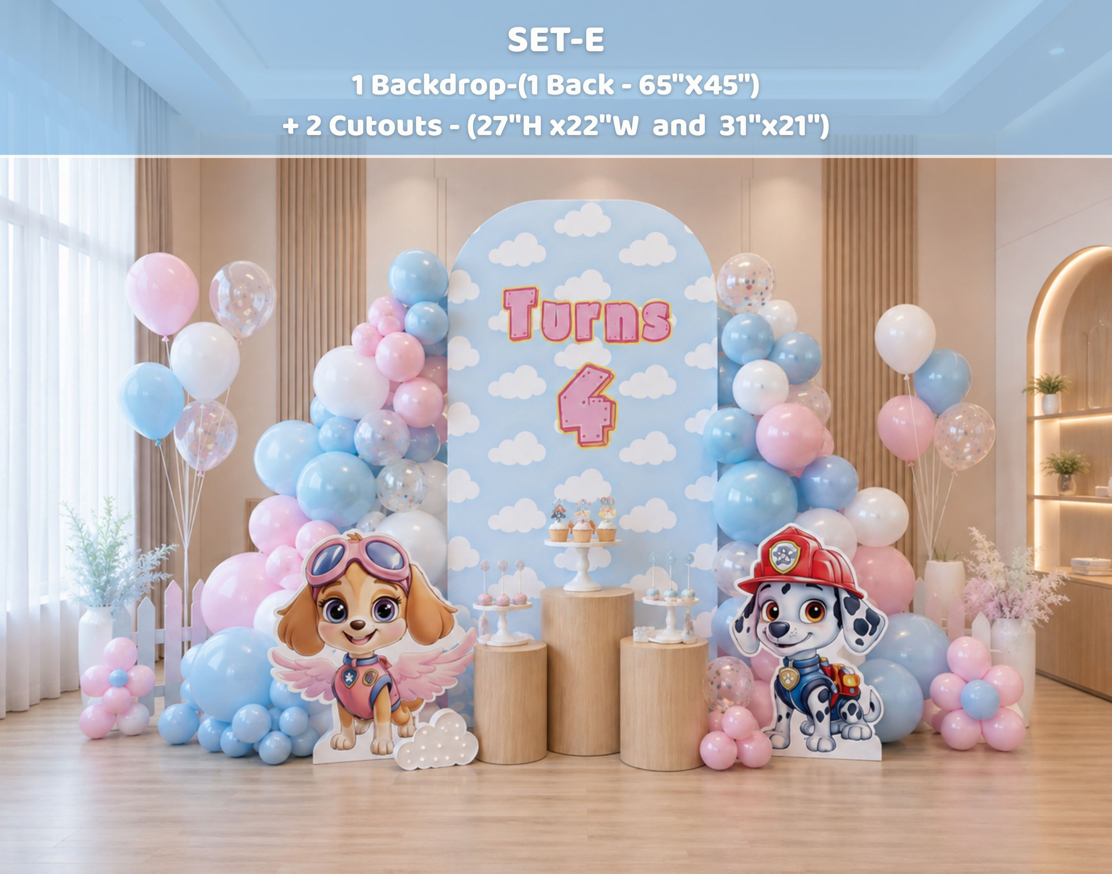 Indoor puppy birthday backdrop with pink and blue balloon decor, layered panels and character cutouts for a themed girls party.