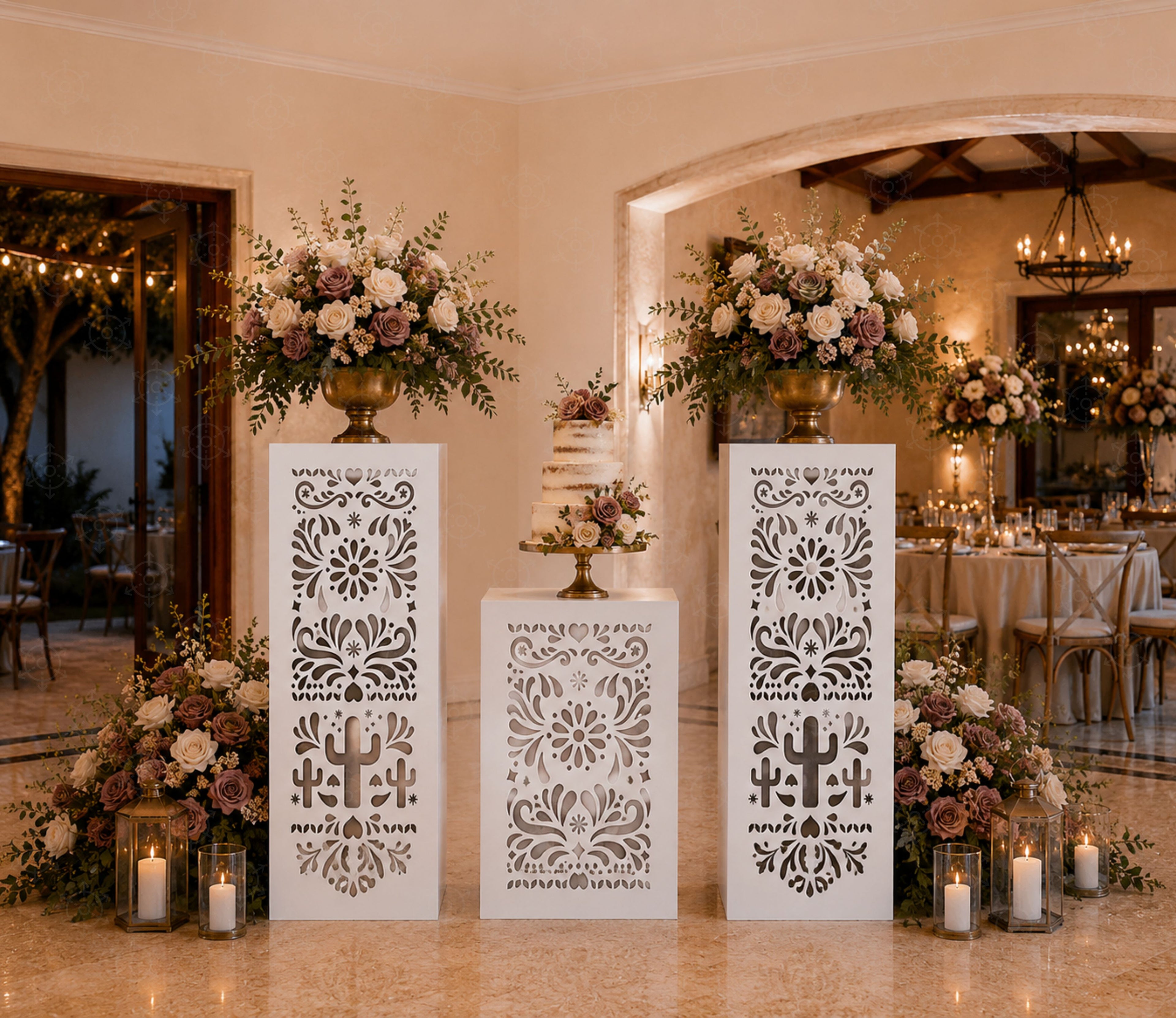 White Papel Picado pedestal set styled with neutral floral decor for a Mexican-inspired event